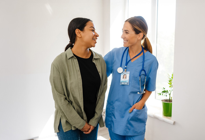 Doctor offering support to patient in a clinic